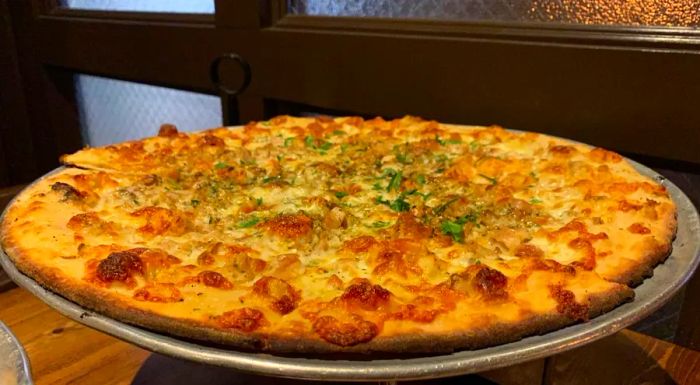 The clam pizza from Denino's Pizzeria and Tavern in Greenwich Village is also available at their Staten Island location.