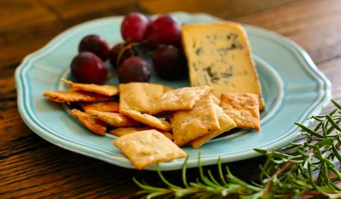 Sourdough rosemary crackers with cheese and grapes.