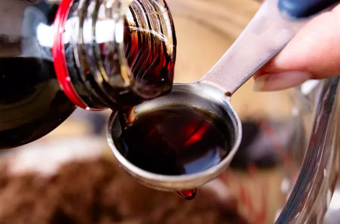 Close-up of measuring vanilla extract