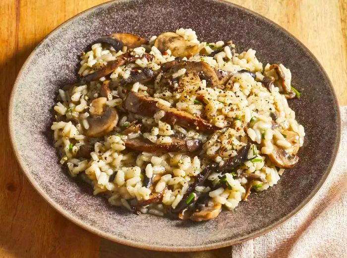 A close-up shot of a single serving of gourmet mushroom risotto