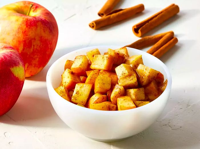 Cinnamon apples served in a white bowl