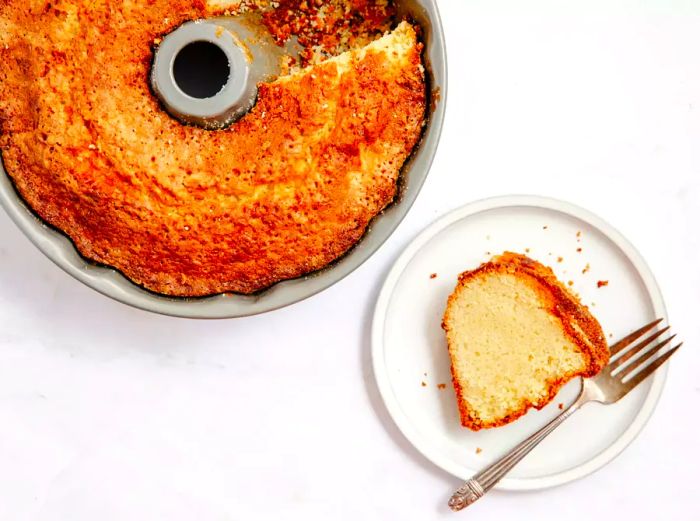 A buttermilk pound cake with a slice cut out.