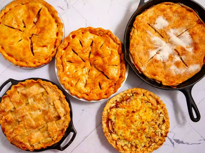 overhead view of five apple pies