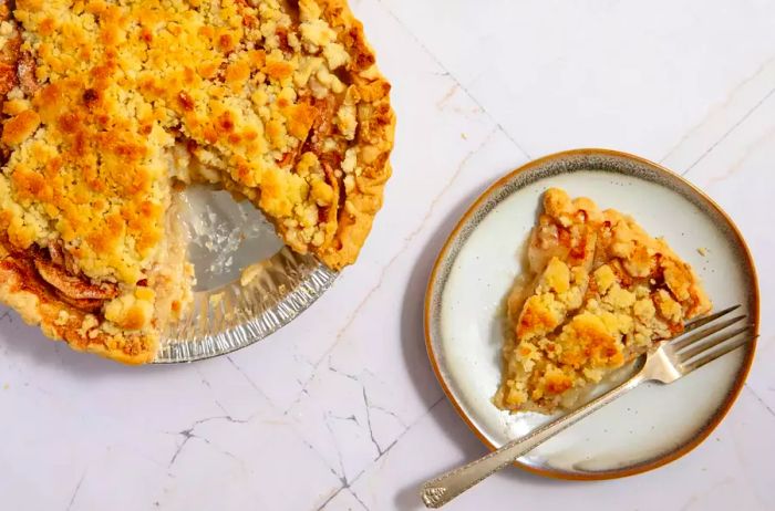 Apple crumble pie with a slice cut out