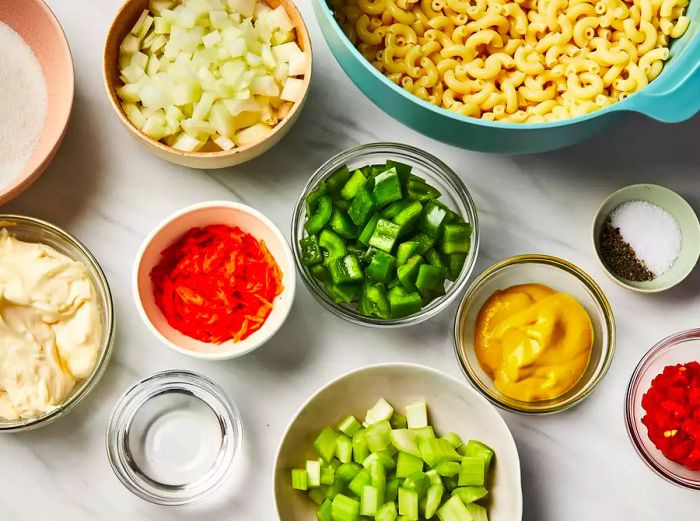 All the ingredients needed for a classic macaroni salad.