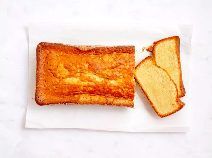 A butter pound cake resting on a white towel.