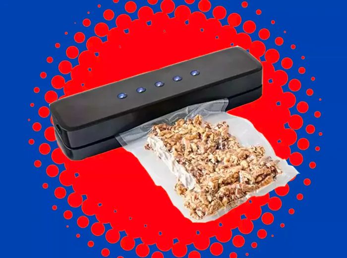 A vacuum sealer paired with a bag of nuts, set against a vibrant blue and coral burst background.