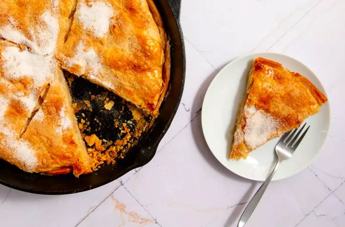 Grandma's cast-iron skillet pie with a slice removed