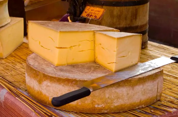 A selection of Gruyère cheese at a French farmers market