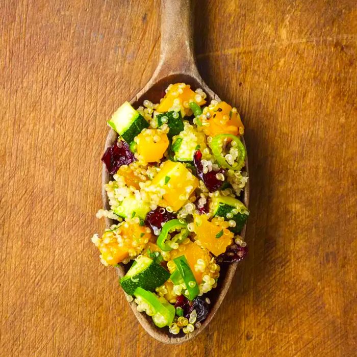 Quinoa stuffing on a wooden spoon