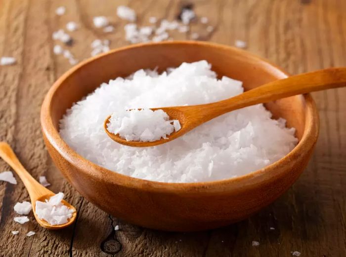 fleur de sel in a rustic wooden bowl