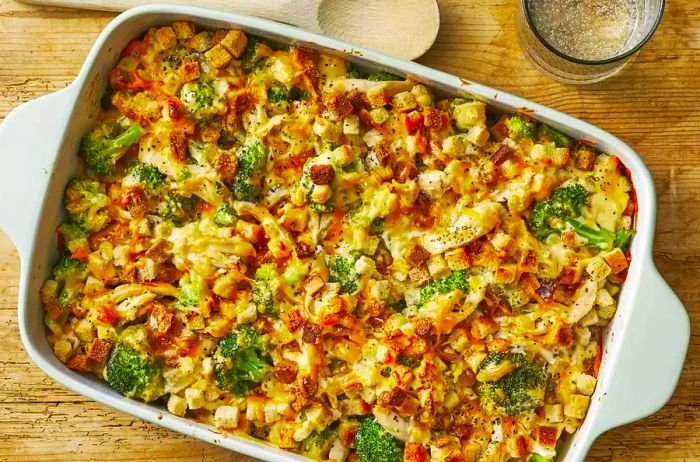 An overhead shot of broccoli chicken casserole in a 9x13 baking dish