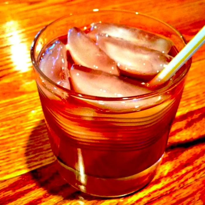 A close-up shot of a Grateful Dead Cocktail served in a glass with a straw