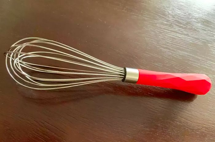 A mini whisk may be small, but it can handle multiple tasks in the kitchen. Essentially a compact version of the balloon whisk, it’s perfect for quick jobs like scrambling eggs or stirring a hot beverage. It’s also a handy tool for making a quick vinaigrette.