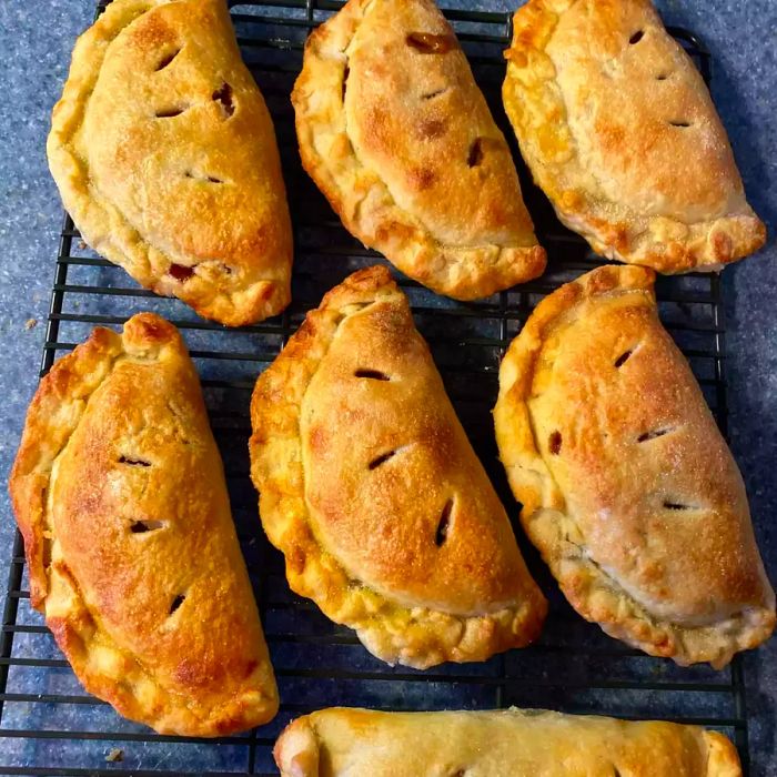 overhead view of homemade Apple Hand Pies on a cooling rack