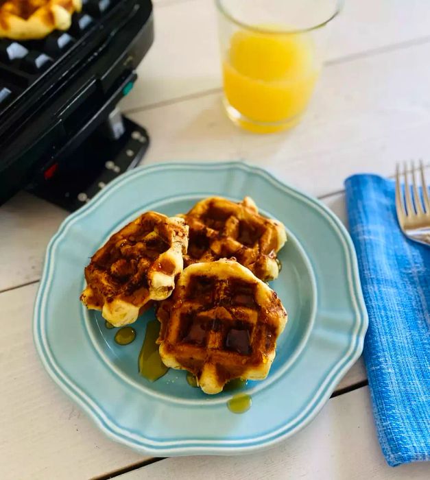 canned cinnamon roll dough cooked in a waffle maker