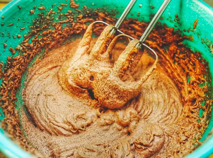 A close-up view of a bowl filled with cake mix