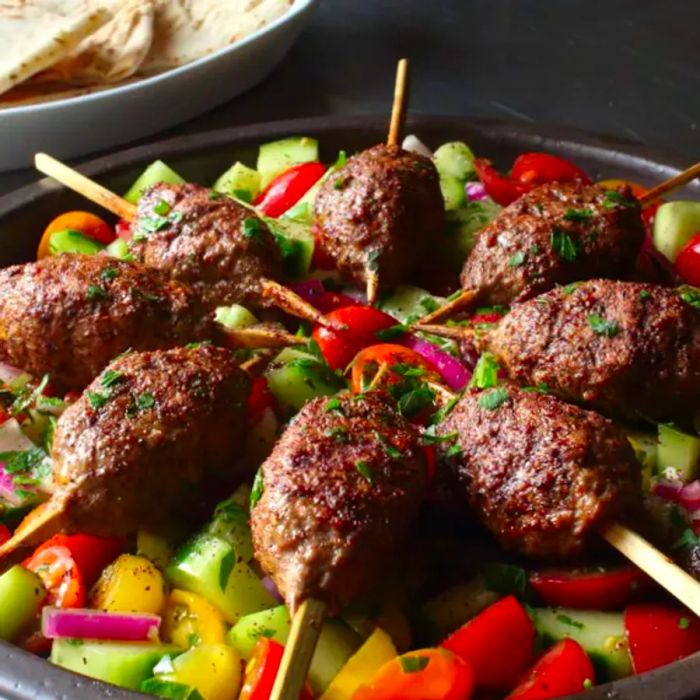 succulent ground beef kabobs served on skewers with a medley of vegetables