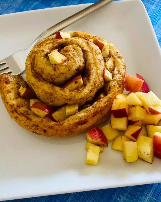 cinnamon rolls topped with fresh fruit for a delicious twist