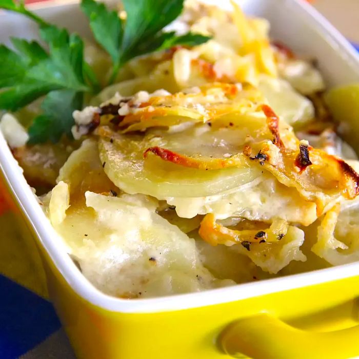 A dish of creamy scalloped potatoes baked to perfection.