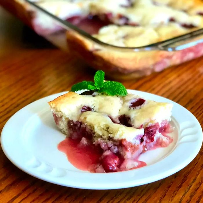 A slice of cherry dump pudding cake