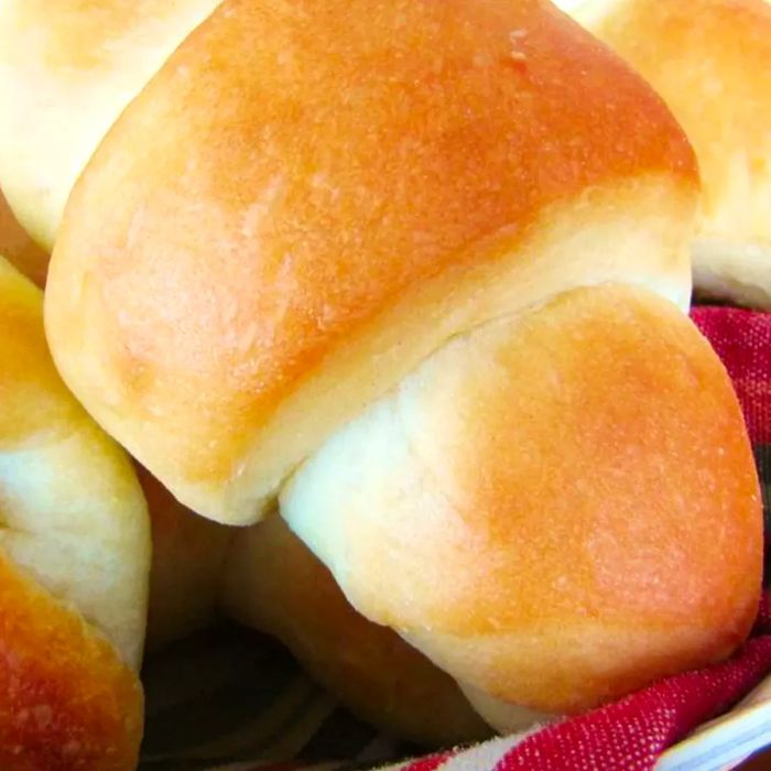 Fluffy sweet dinner rolls served in a bread basket.