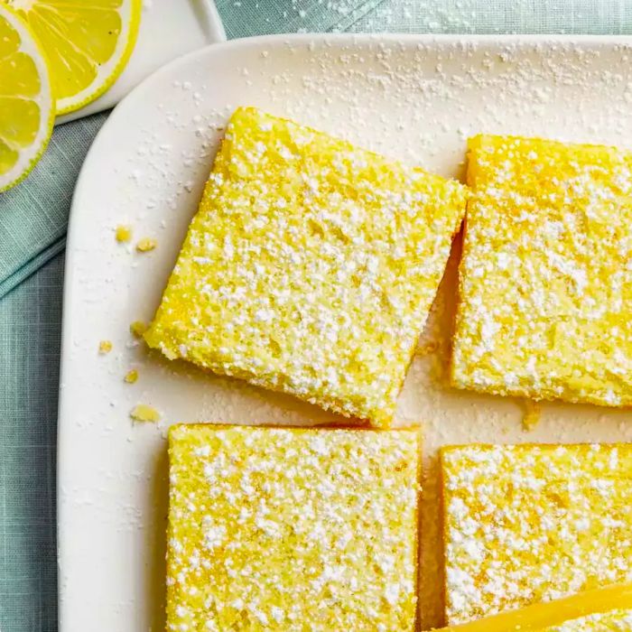 A top-down view of The Best Lemon Bars served on a white platter