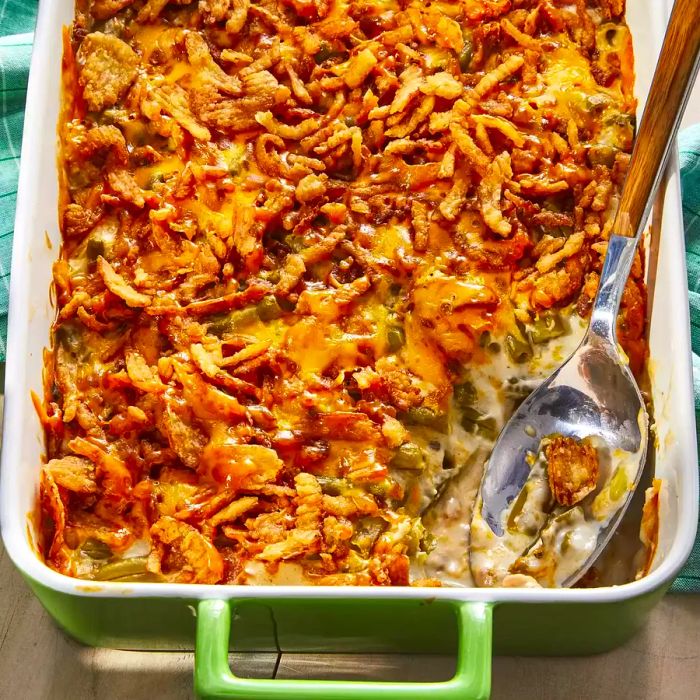 An overhead shot of a delicious Green Bean Casserole recipe baked in a casserole dish.