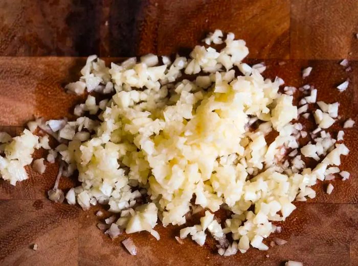 Close-up shot of a pile of freshly minced garlic.