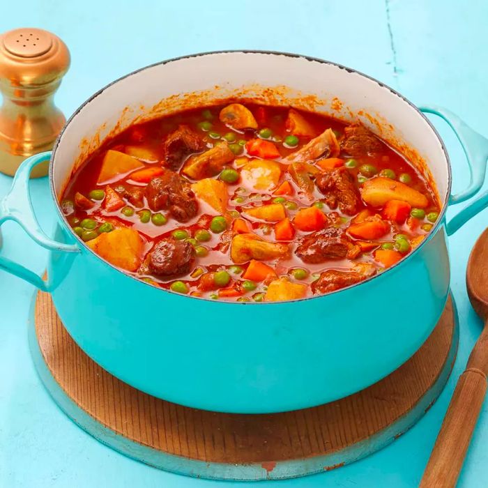 Close-up shot of beef stew simmering in a pot