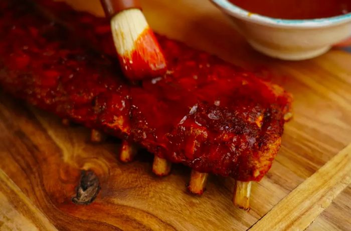 Coating Grilled Baby Back Ribs with Barbecue Sauce