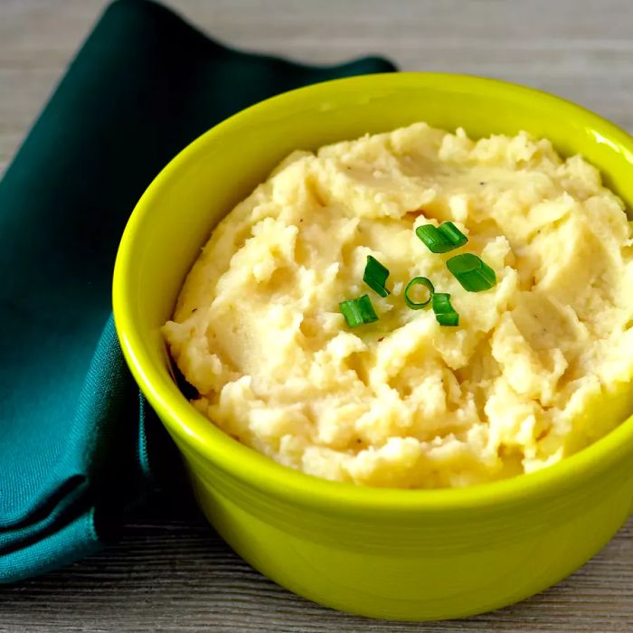 Make-Ahead Mashed Potatoes in a Lime-Green Dish