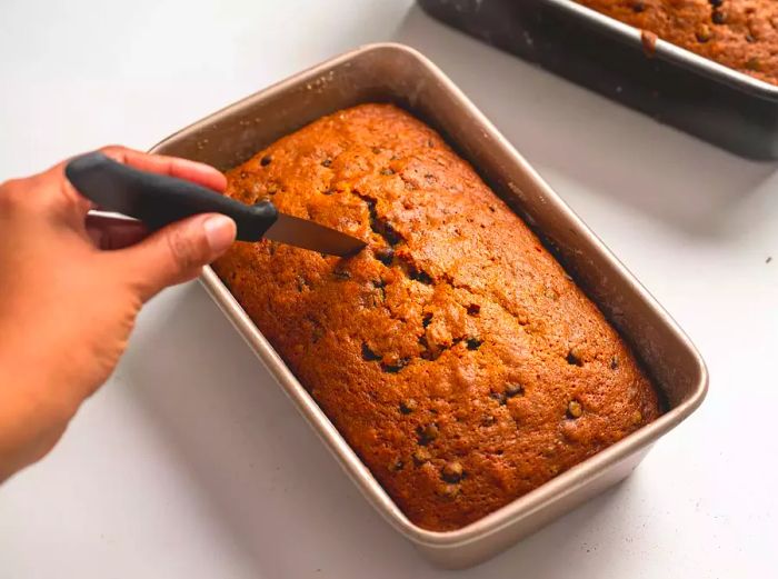 A knife being tested in the bread.