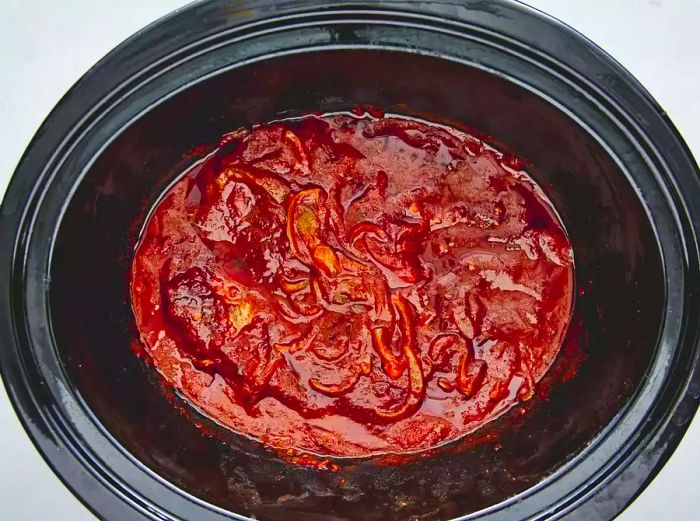 Shredded beef in the slow cooker, ready to be served.