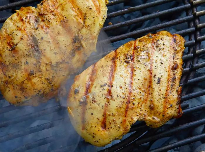 Grilled chicken breasts with a seasoning crust and grill marks