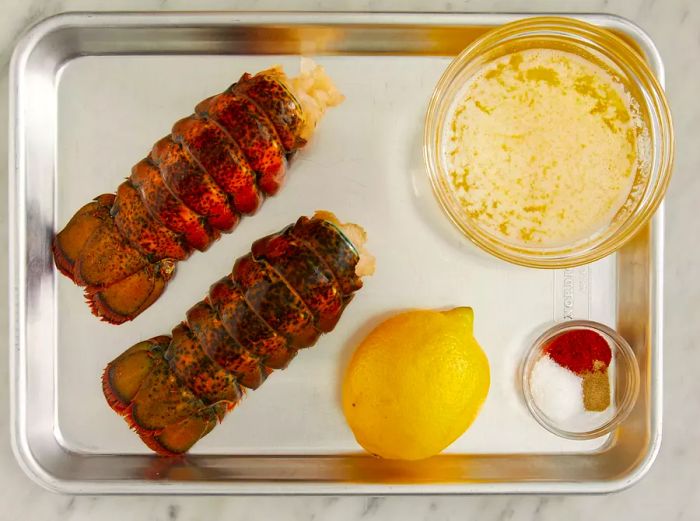 A top-down view of the ingredients measured and ready for broiling the lobster tails.