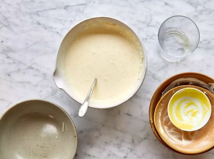 A bowl of creamy dressing made with Parmesan, mayonnaise, sour cream, mustard, and dill pickle brine