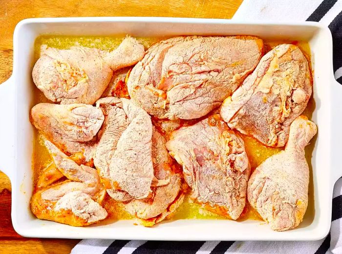 Chicken in a baking dish, ready to be placed in the oven