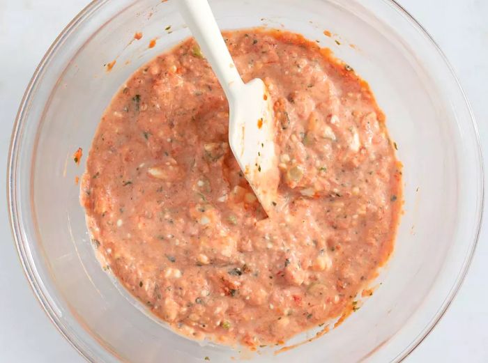 Salsa, cream cheese, and green onions blended together in a bowl