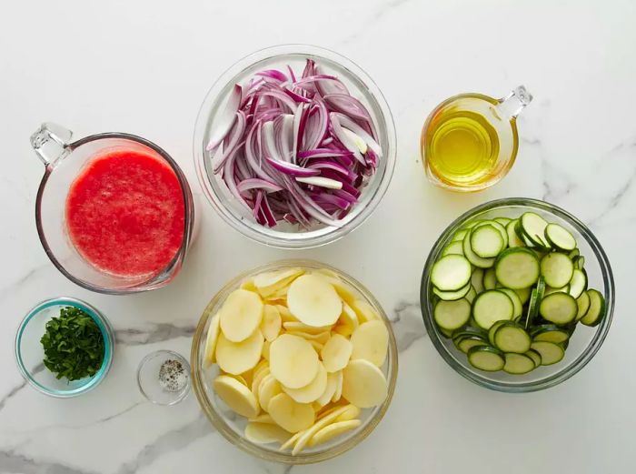 Overhead shot of ingredients in glass bowls and measuring cups