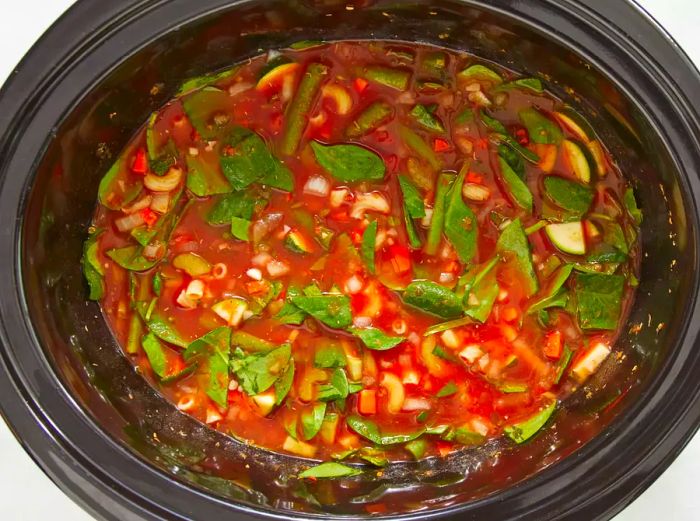 The elbow macaroni has been added to the slow cooker.