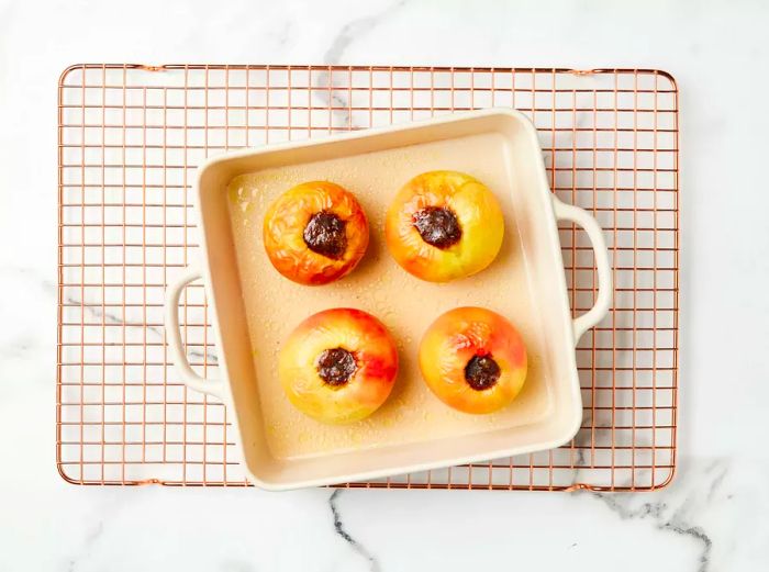 Baked apples cooling on a wire rack