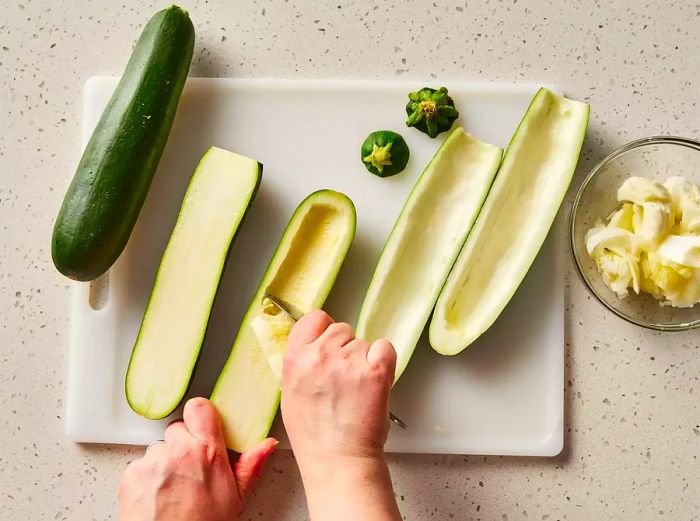 Zucchini being prepared and trimmed