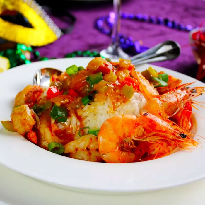 Close-up of Chef John's Shrimp Étouffée served in a white bowl with a spoon.