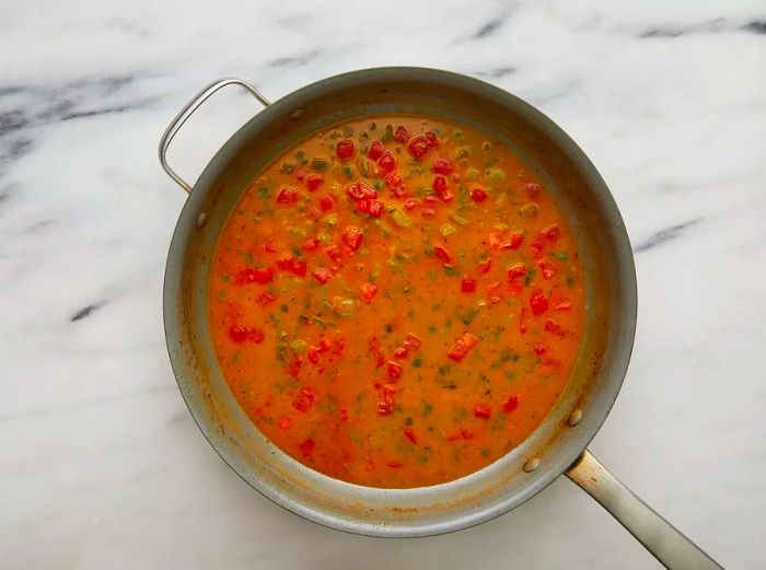 The remaining ingredients are whisked into the skillet and simmered until the sauce thickens slightly.