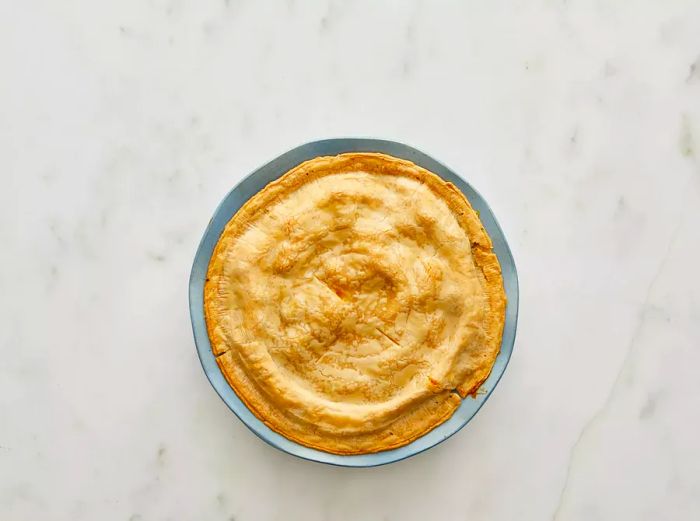 Bird's-eye view of a freshly baked pot pie in a baking dish.