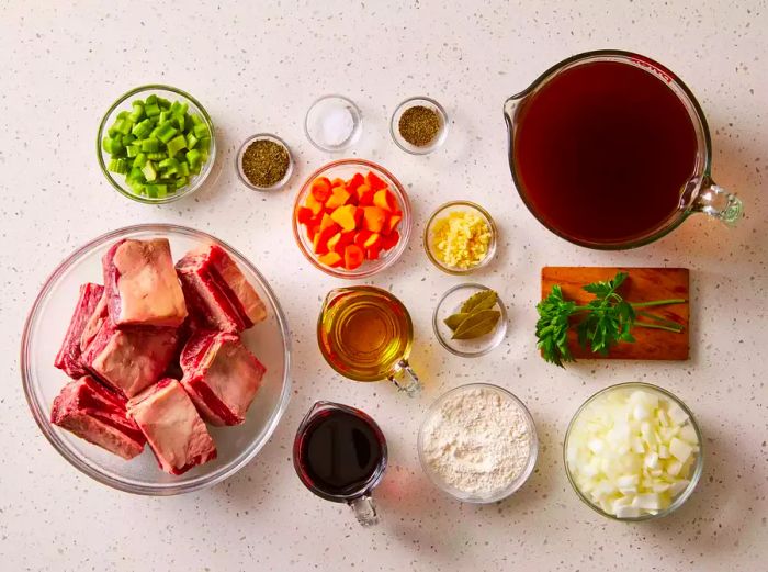 Beef Short Ribs Ingredients Displayed on a Clean White Countertop