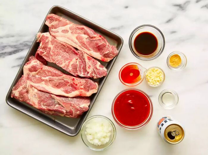 Oven-Roasted Ribs Ingredients Arranged on a Marble Countertop