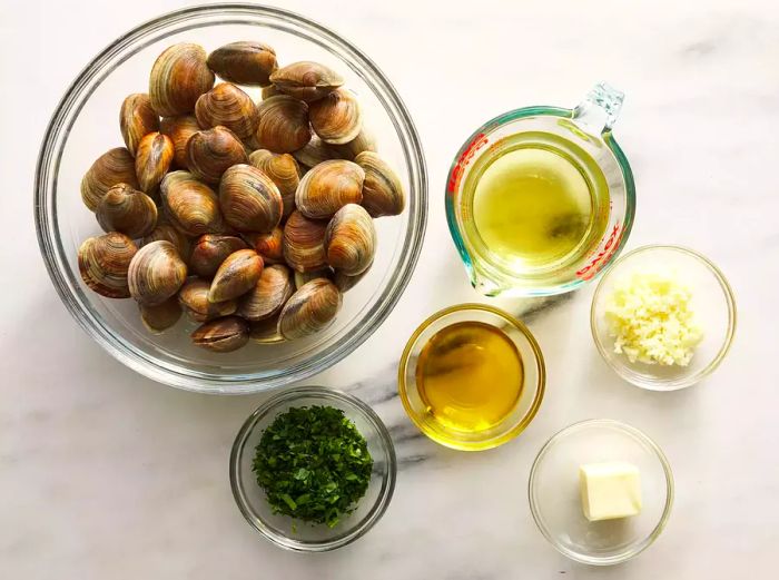 All ingredients are prepared and ready for the clams and garlic dish.