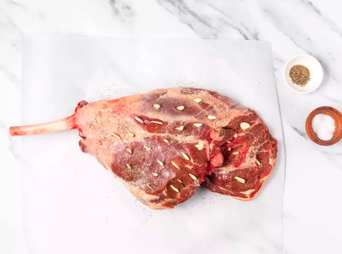 Garlic cloves inserted into the leg of lamb before roasting.